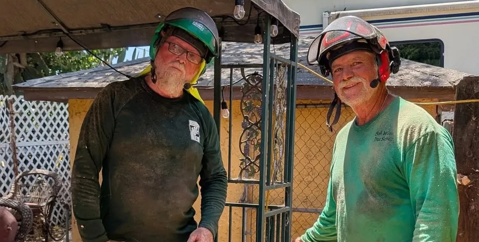ISA Certified Arborist Bob Wining and a crew member wearing protective equipment at an East County jobsite